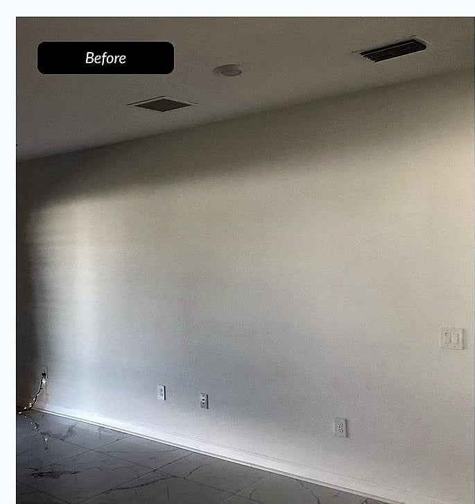 Before: lit media wall with fireplace