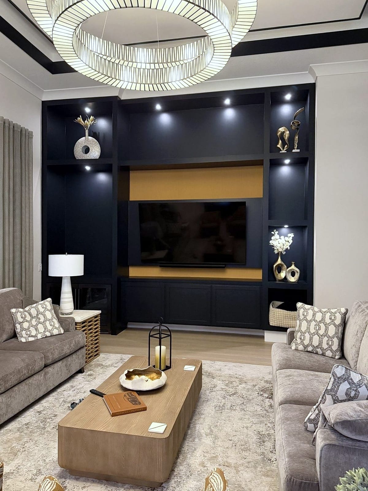 Navy custom built-in media wall with lit shelving