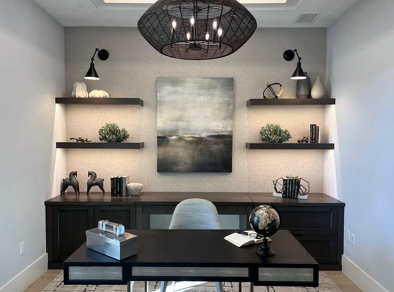 Custom home office built-in with floating shelves and lighting